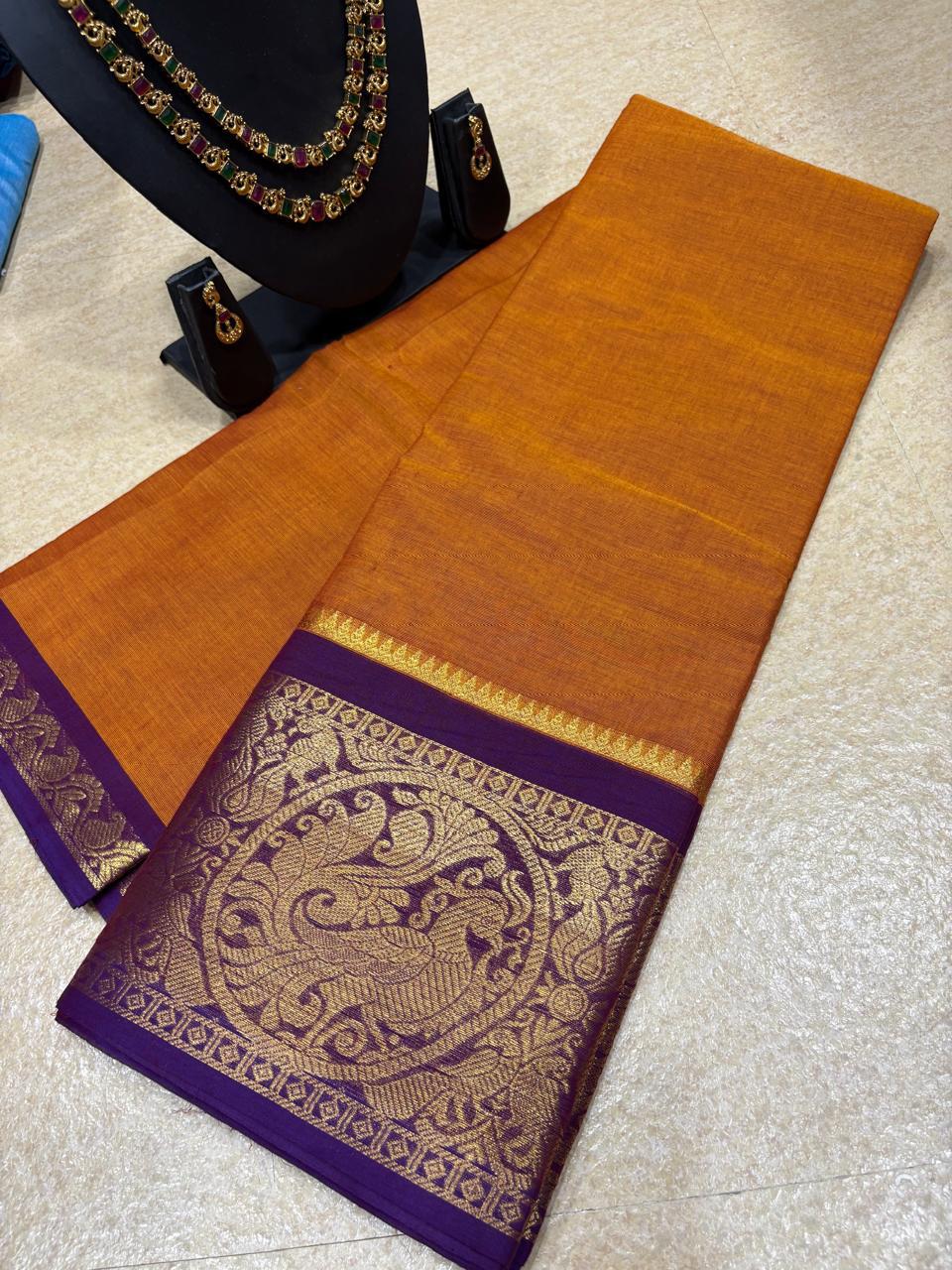 KC-DIYA: Burnt Orange Kanchi Cotton Saree with Royal Purple Zari Border