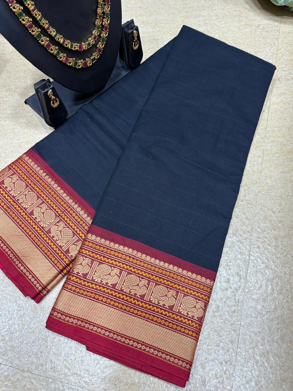 KV-TEJASVI: Black Kanchi Sugundi Veldhari Saree with Gold and Red Border